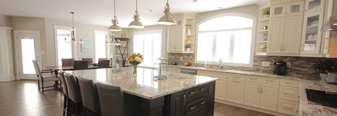 image of kitchen with L shaped counter and center island